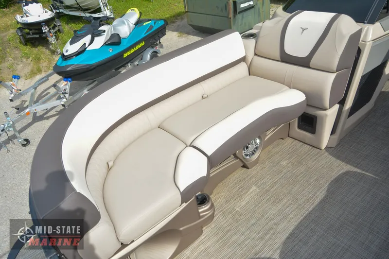 Slide: The Image of 2024 Tahoe Pontoon Cascade Elite Windshield boat interior with beige seating. - 12