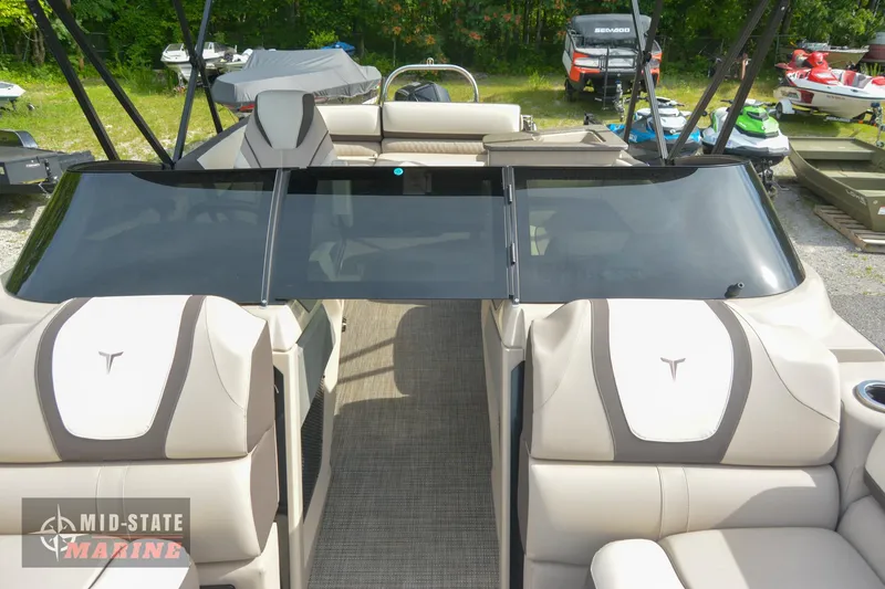Slide: The Image of 2024 Tahoe Pontoon Cascade Elite Windshield interior with beige seating and windshield. - 13