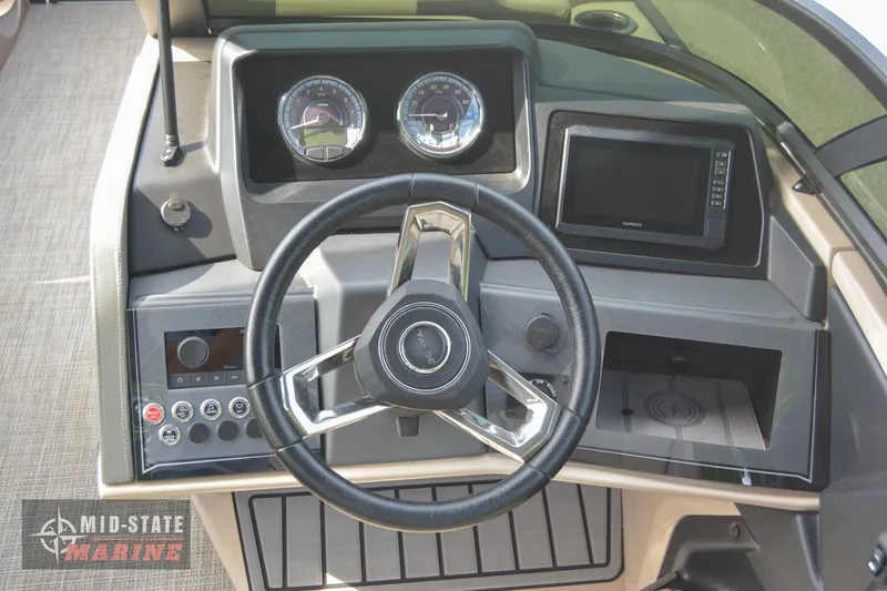 Slide: The Image of 2024 Tahoe Pontoon Cascade Elite Windshield dashboard with steering wheel and control panel. - 21