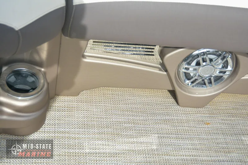 Slide: The Image of 2024 Tahoe Pontoon Cascade Elite Windshield interior with speaker and cup holder. - 30