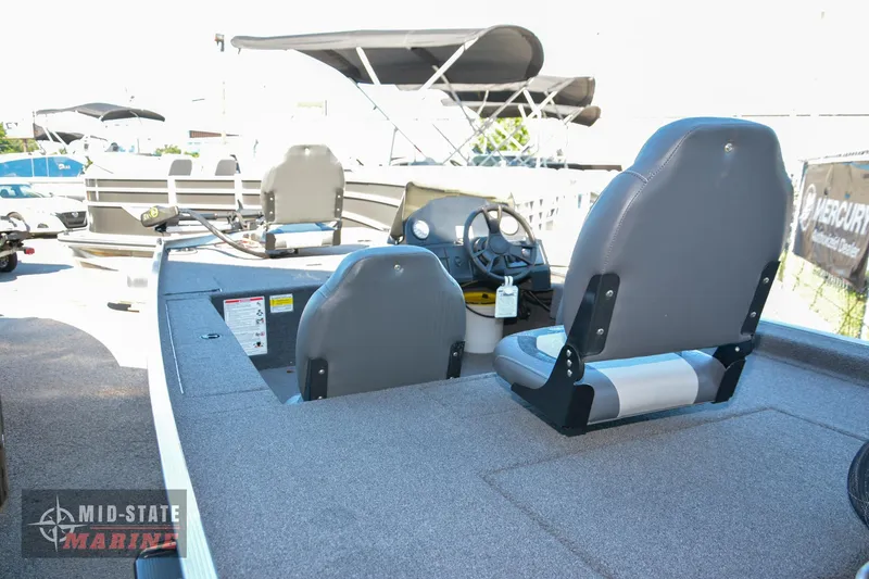 Slide: The Image of 2024 Lowe Skorpion 16 fishing boat interior with seating and steering console. - 11