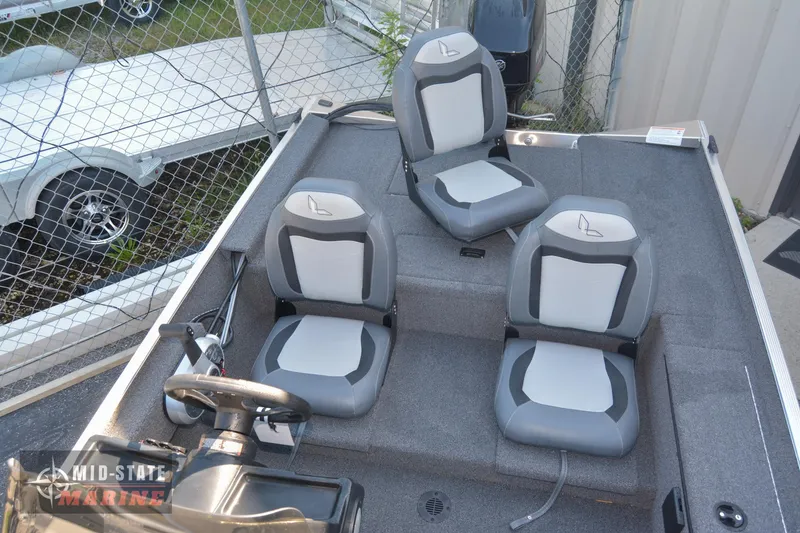 Slide: The Image of 2024 Lowe Skorpion 16 boat interior with three gray and white seats. - 12