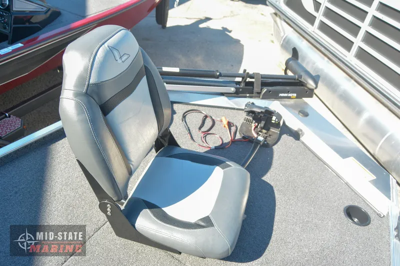 Slide: The Image of 2024 Lowe Skorpion 16 boat seat and control panel on deck. - 13