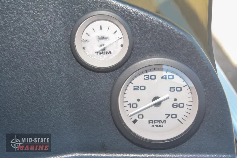 Slide: The Image of Close-up of 2024 Lowe Skorpion 16 boat dashboard with RPM gauges. - 16
