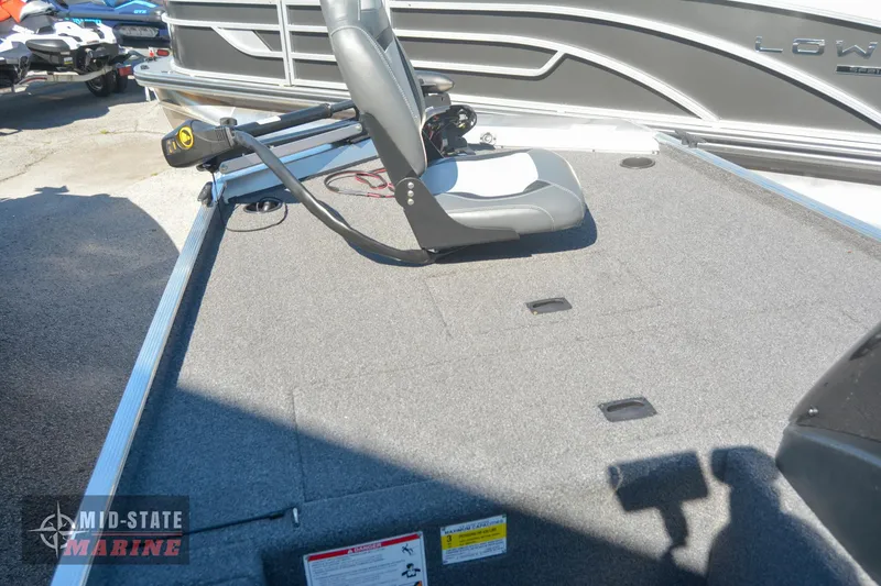 Slide: The Image of 2024 Lowe Skorpion 16 fishing boat deck with seat and trolling motor. - 22