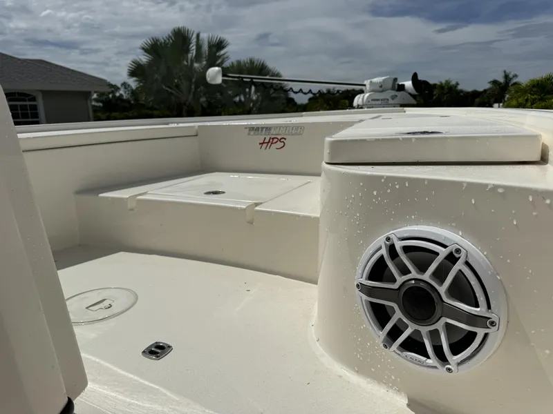 Slide: The Image of 2022 Pathfinder 2300 HPS boat interior with speaker and storage compartments. - 14