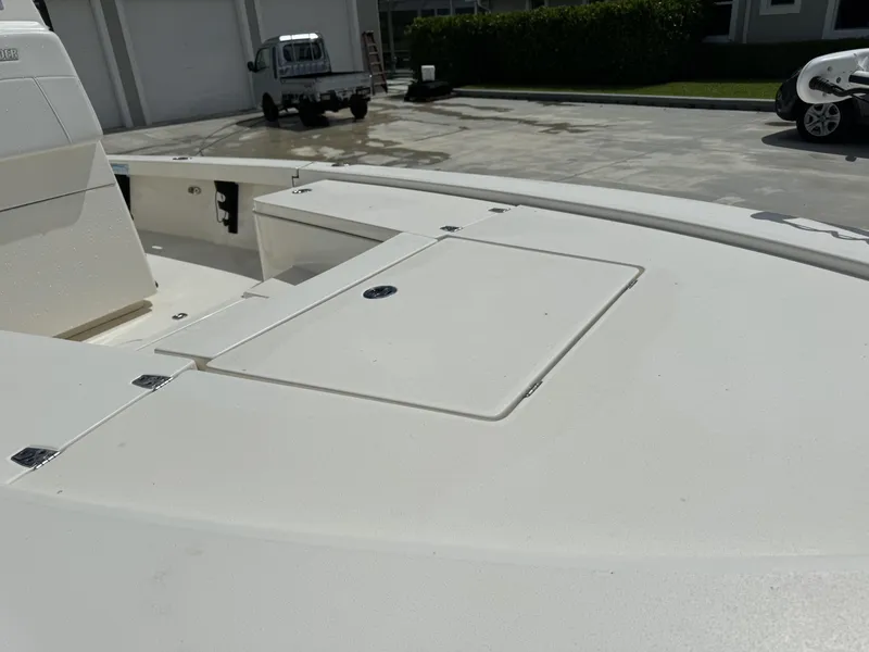 Slide: The Image of 2022 Pathfinder 2300 HPS boat deck with storage compartment. - 17