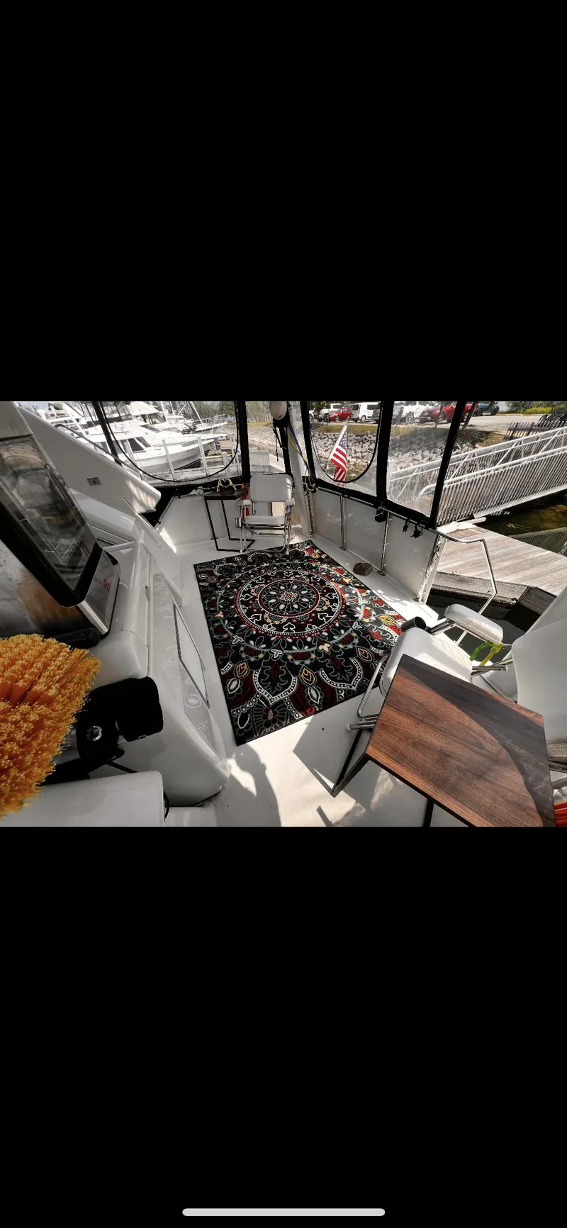 Slide: The Image of 1997 Carver 355 Main Ship Aft Cabin interior with nautical decor and marina view. - 24