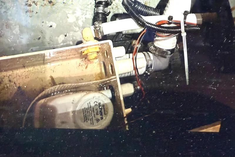 Slide: The Image of 1997 Carver 355 Main Ship Aft Cabin bilge pump and plumbing components. - 27