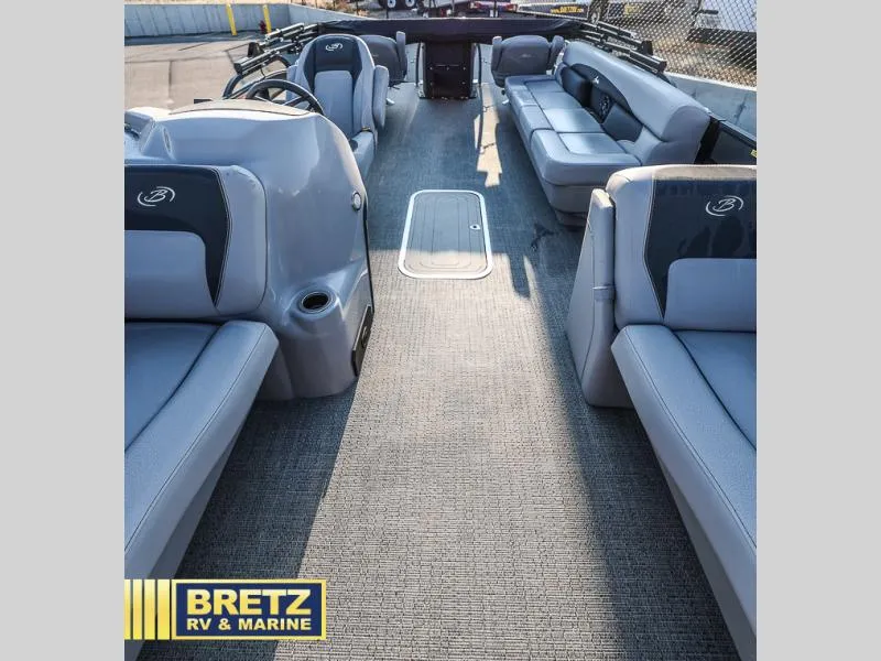 Slide: The Image of 2025 Aria Ultra-Lounge 22UC boat interior with gray seating and carpeted floor. - 17