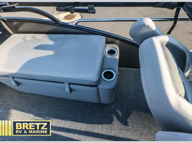 Slide: The Image of 2025 Aria Ultra-Lounge 22UC boat interior with cushioned seating and cup holders. - 27