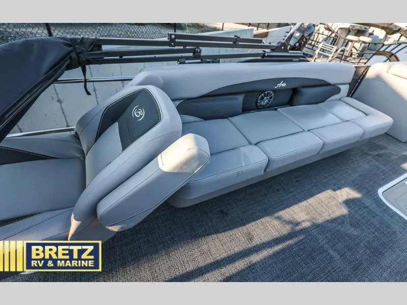 Slide: The Image of 2025 Aria Ultra-Lounge 22UC boat interior with gray seating, Bretz RV & Marine logo. - 30