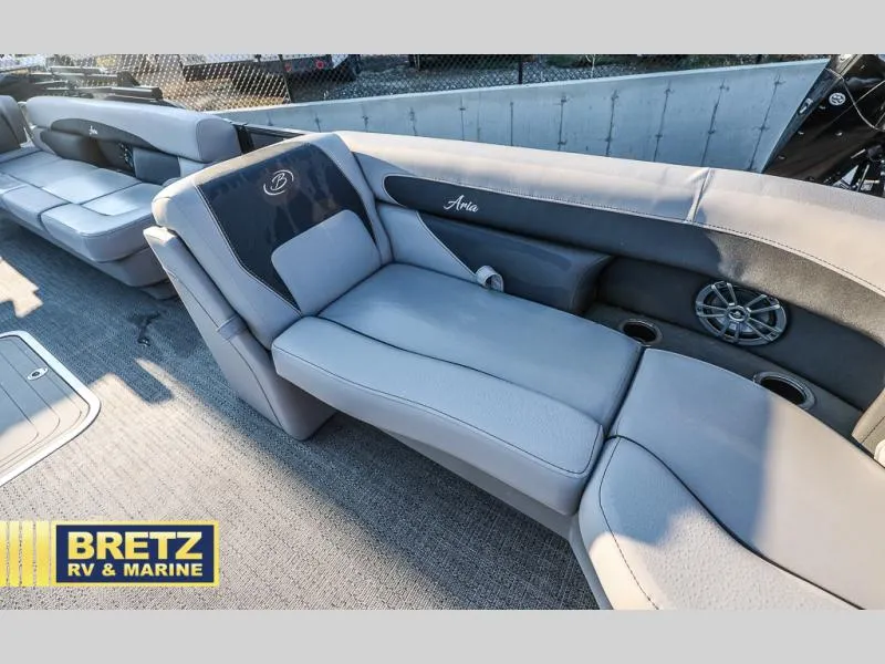 Slide: The Image of 2025 Aria Ultra-Lounge 22UC boat interior with plush seating and cup holders. - 32