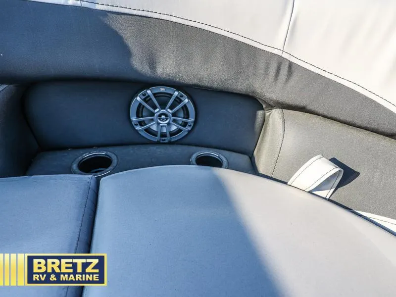 Slide: The Image of Aria Ultra-Lounge 22UC 2025 boat seating with speaker and cup holders. - 33