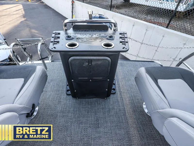 Slide: The Image of Aria Ultra-Lounge 22UC 2025 boat interior with seating and control panel. - 36