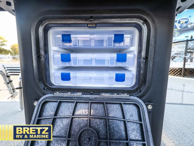 Slide: The Image of Aria Ultra-Lounge 22UC 2025 storage compartment with organized plastic containers. - 37