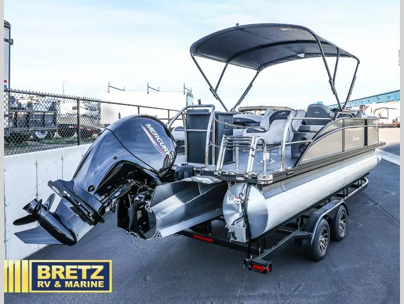 Slide: The Image of 2025 Aria Ultra-Lounge 22UC pontoon boat with Mercury engine on trailer. - 5