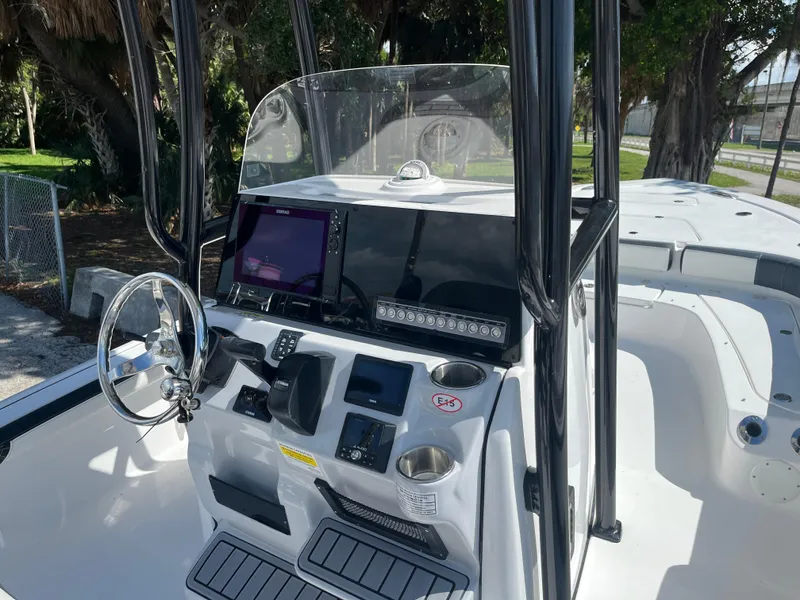 Slide: The Image of 2025 Tidewater 2300 Carolina Bay boat console with advanced navigation system. - 10