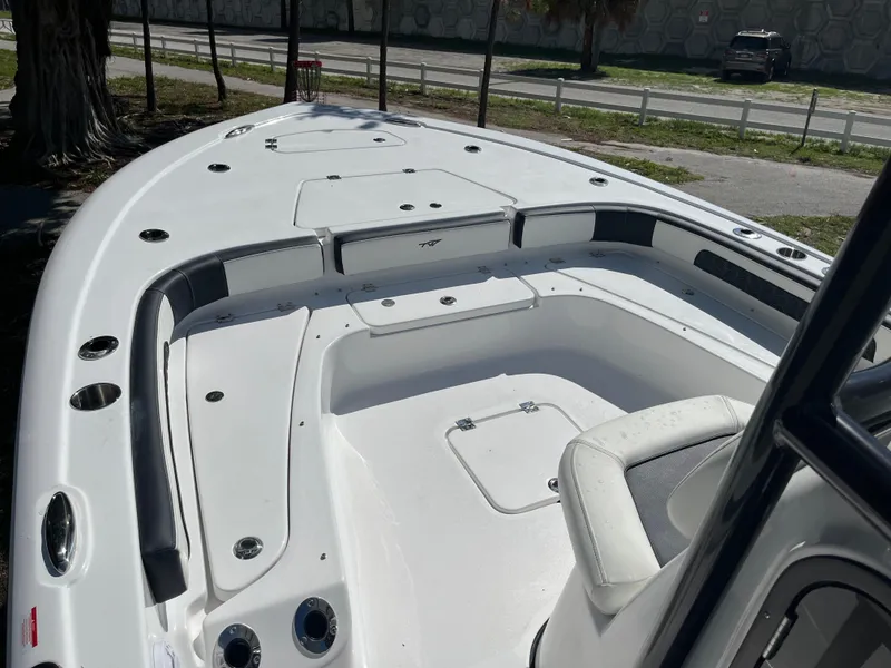 Slide: The Image of 2025 Tidewater 2300 Carolina Bay boat interior, spacious seating and storage compartments. - 4