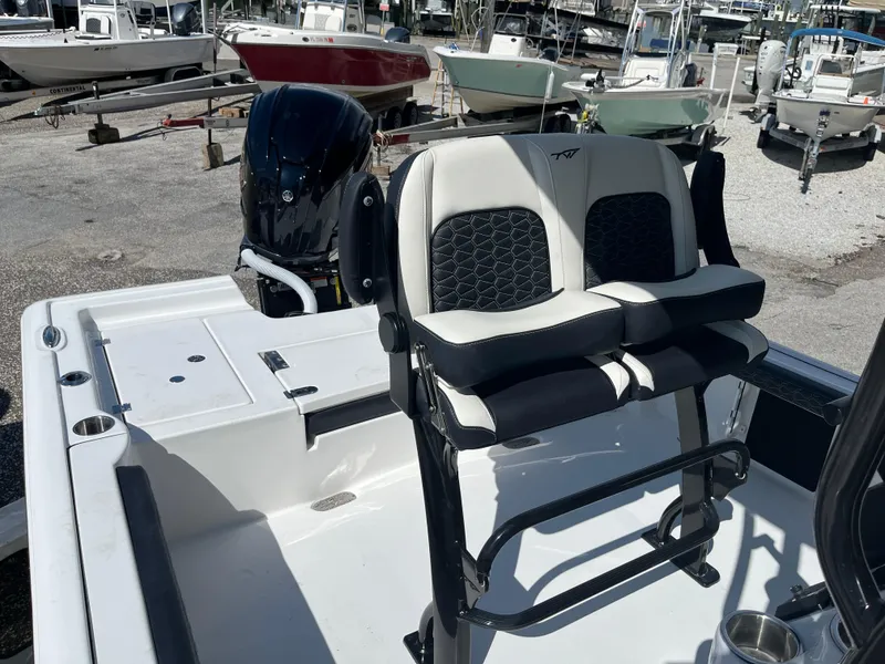 Slide: The Image of 2025 Tidewater 2300 Carolina Bay boat with dual seats and outboard motor. - 6