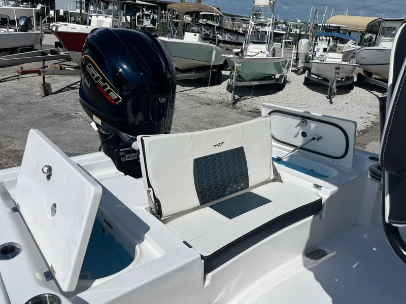 Slide: The Image of 2025 Tidewater 2300 Carolina Bay boat with seating and storage compartments. - 8