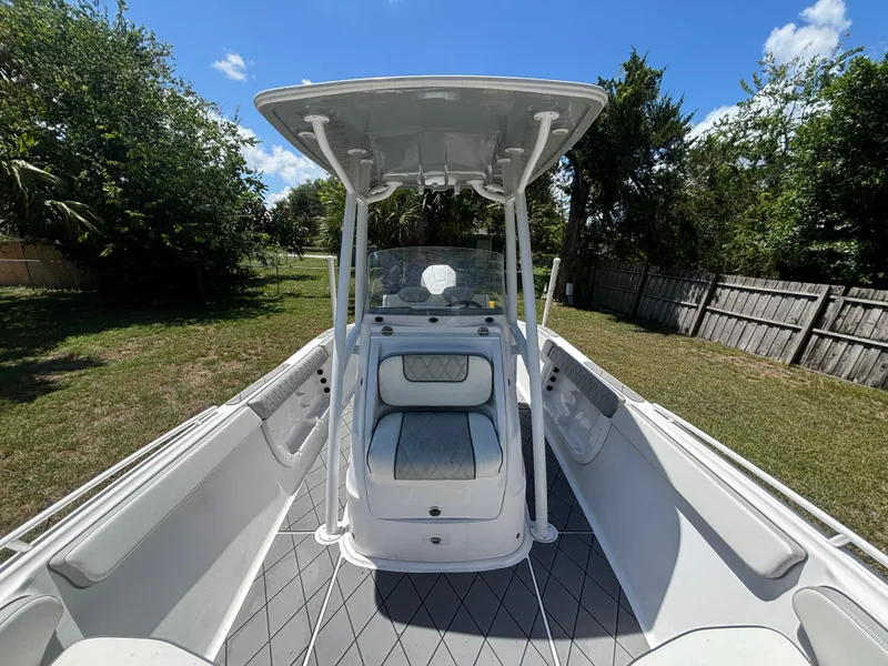 Slide: The Image of 2023 ALK2 Powerboats 25 CRX center console boat in a grassy yard. - 10