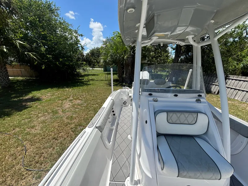 Slide: The Image of 2023 ALK2 Powerboats 25 CRX in a grassy yard, showcasing sleek design and seating. - 12