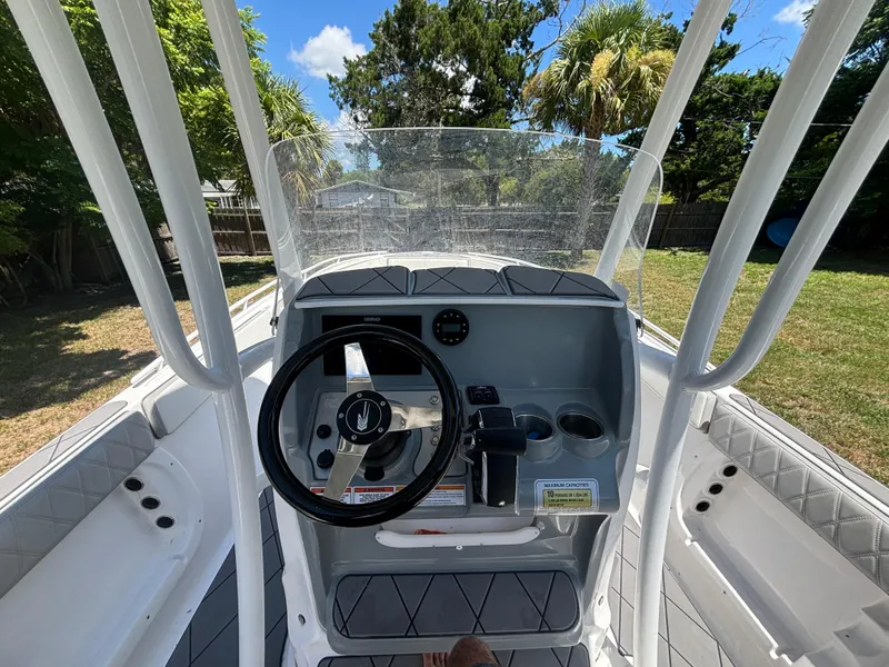 Slide: The Image of 2023 ALK2 Powerboats 25 CRX cockpit with steering wheel and controls. - 15