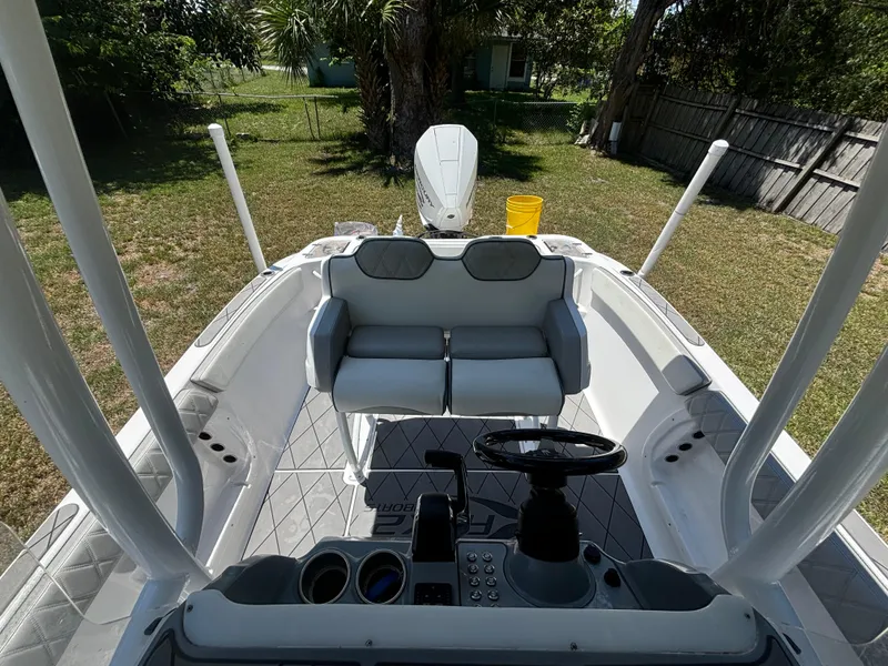 Slide: The Image of 2023 ALK2 Powerboats 25 CRX interior with dual seats and steering console. - 17