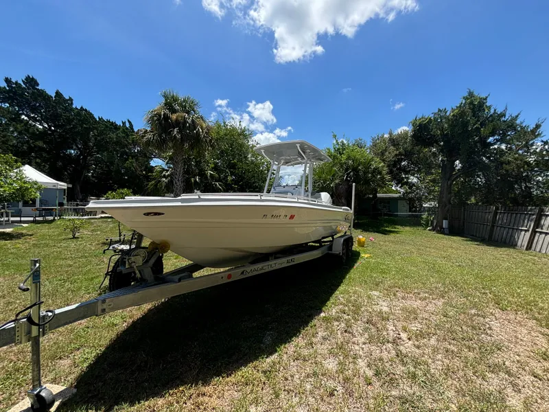 Slide: The Image of 2023 ALK2 Powerboats 25 CRX on trailer in sunny yard. - 2