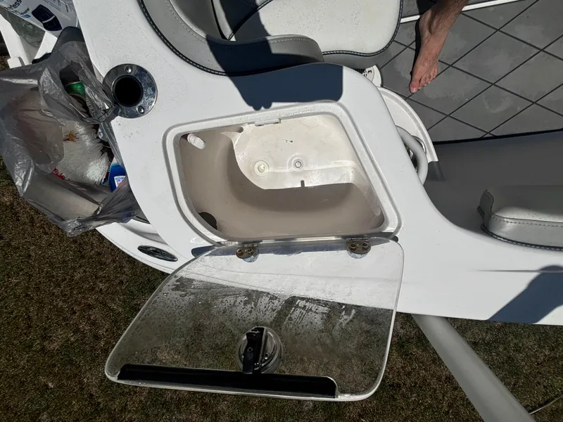Slide: The Image of Open storage compartment on 2023 ALK2 Powerboats 25 CRX, showing interior details. - 20