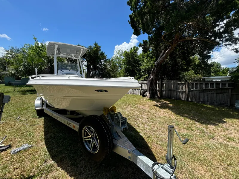 Slide: The Image of 2023 ALK2 Powerboats 25 CRX on trailer in sunny backyard setting. - 3