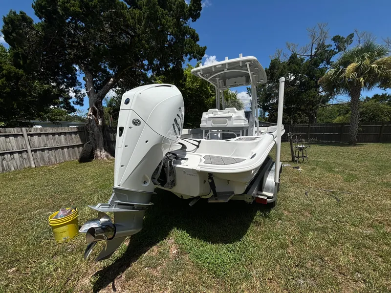 Slide: The Image of 2023 ALK2 Powerboats 25 CRX in a grassy yard, showcasing its sleek design and powerful engine. - 7