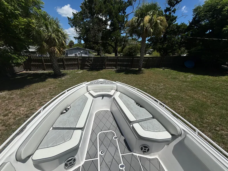 Slide: The Image of 2023 ALK2 Powerboats 25 CRX bow seating area in a grassy yard. - 9