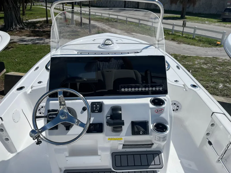 Slide: The Image of 2025 Tidewater 2110 Bay Max boat console with steering wheel and controls. - 6