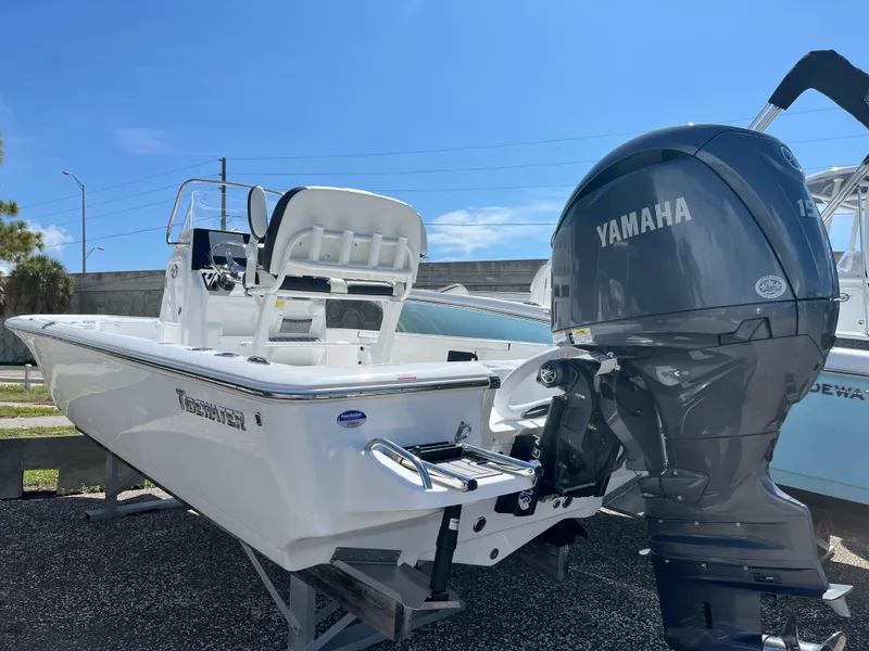 Slide: The Image of 2025 Tidewater 2110 Bay Max boat with Yamaha engine in a sunny outdoor setting. - 9