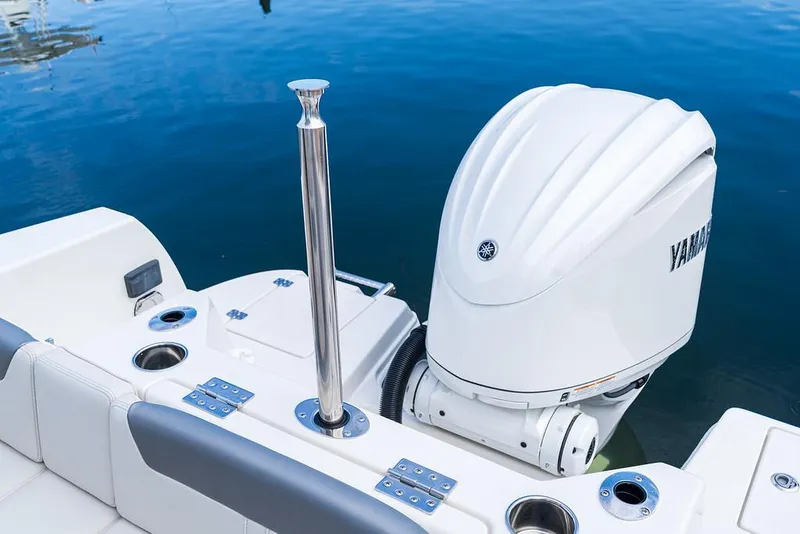 Slide: The Image of 2025 Sailfish 232 CC boat with Yamaha outboard motor on calm water. - 10