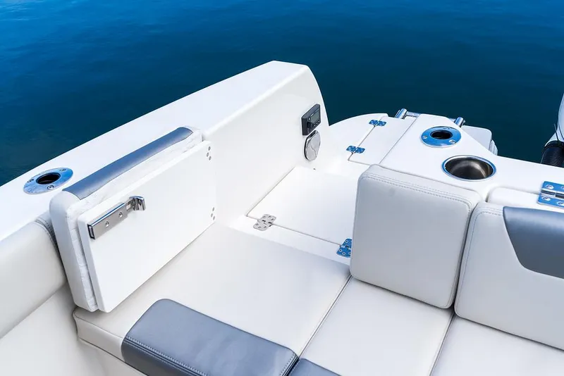 Slide: The Image of 2025 Sailfish 232 CC boat interior with white and gray seating. - 11