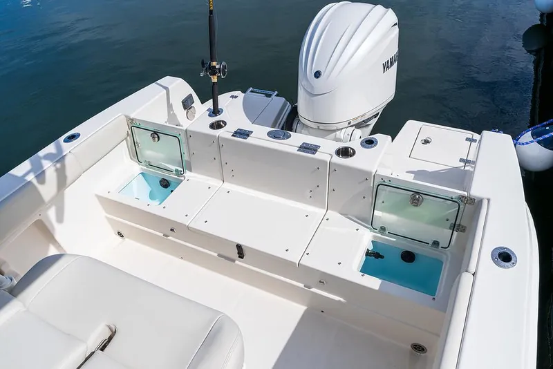 Slide: The Image of 2025 Sailfish 232 CC boat with Yamaha outboard engine and fishing rod holder. - 14