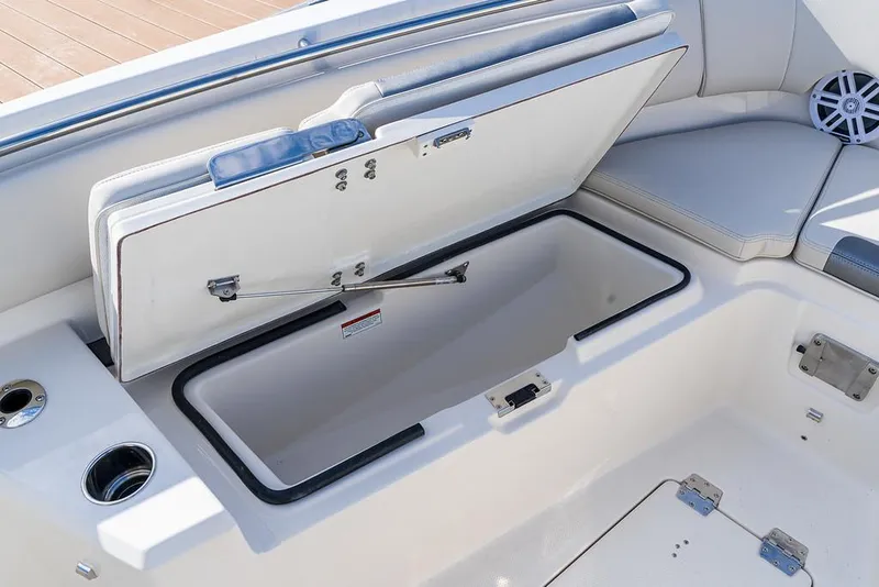 Slide: The Image of Open storage compartment on a 2025 Sailfish 232 CC boat. - 4