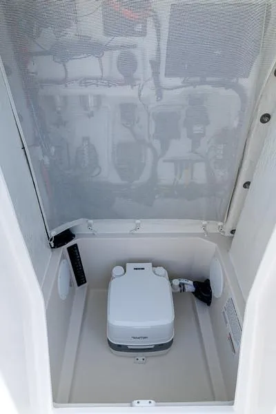 Slide: The Image of Interior of 2025 Sailfish 232 CC boat with portable toilet. - 5