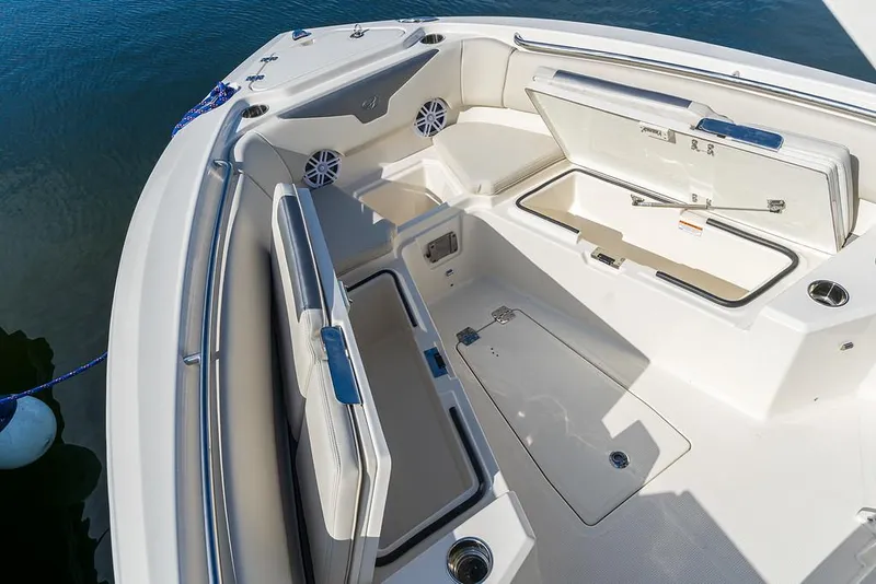 Slide: The Image of 2025 Sailfish 232 CC boat interior with open storage compartments. - 6