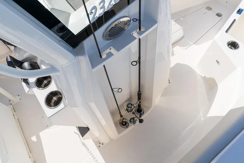 Slide: The Image of 2025 Sailfish 232 CC center console with fishing rod holders and cup holders. - 7