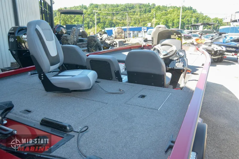 Slide: The Image of 2024 Lowe Stinger 195 Bass boat interior with seating and control console. - 14