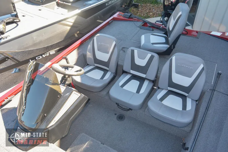 Slide: The Image of 2024 Lowe Stinger 195 Bass boat interior with gray and white seating. - 18