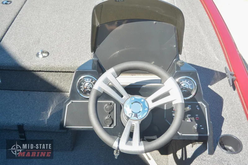 Slide: The Image of 2024 Lowe Stinger 195 Bass boat dashboard and steering wheel. - 20