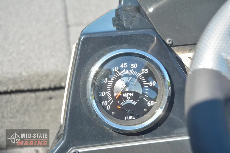 Slide: The Image of 2024 Lowe Stinger 195 Bass boat speedometer and fuel gauge, Mid-State Marine logo. - 21