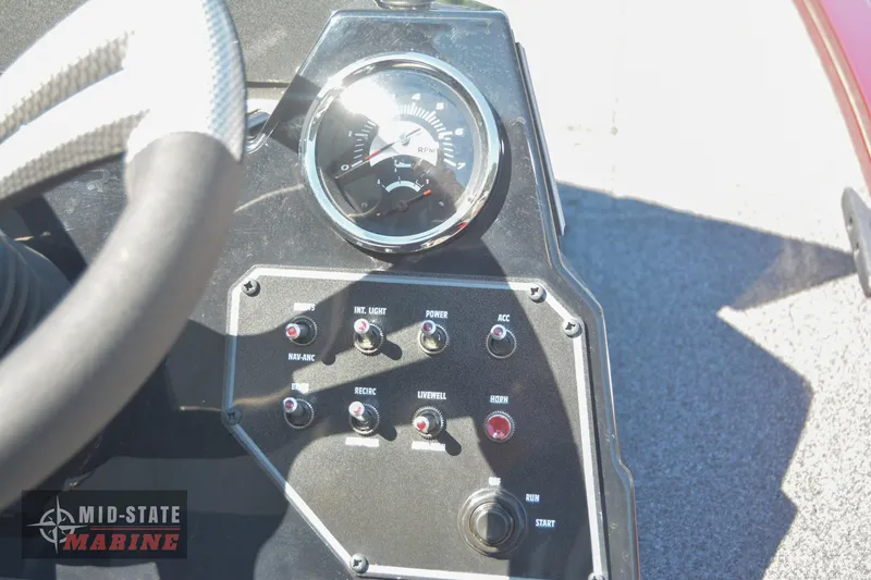 Slide: The Image of Control panel of 2024 Lowe Stinger 195 Bass boat with gauges and switches. - 24