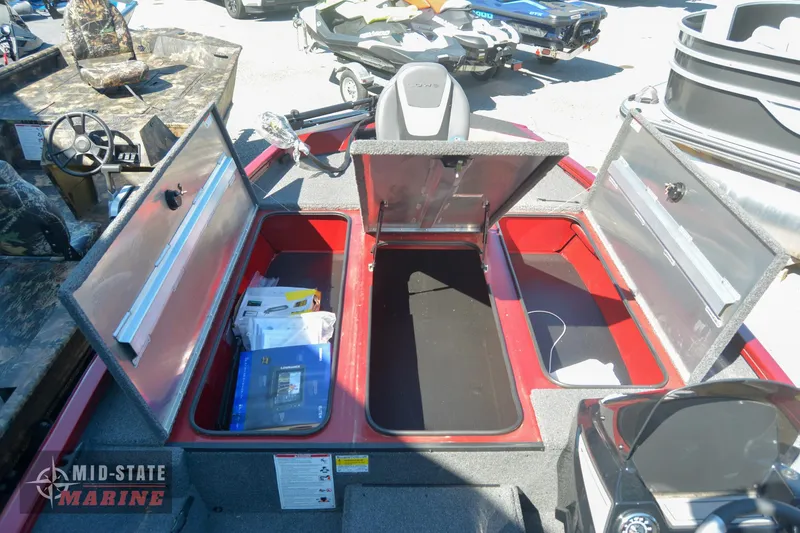 Slide: The Image of 2024 Lowe Stinger 195 Bass boat storage compartments open at Mid-State Marine. - 26