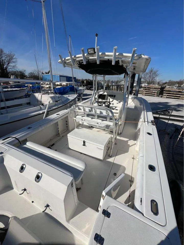 Slide: The Image of 2007 Edgewater 268CC center console boat with seating and storage compartments. - 3